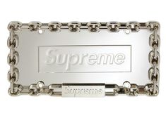 the supreme nameplate is attached to a chain