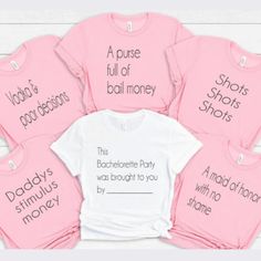 six pink shirts with words on them