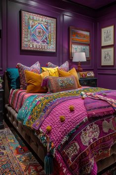 a bedroom with purple walls and lots of colorful pillows on the bed in front of it