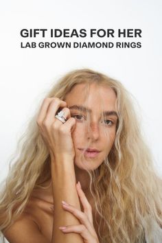 a woman with long blonde hair is holding her hand up to her face and the words, gift ideas for her lab grown diamond rings