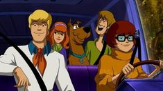 scooby and friends in the back of a car with their hands on the steering wheel