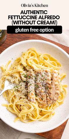 a white plate topped with pasta and meat