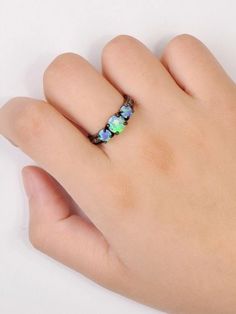 FREE Shipping Worldwide: Opal has always been associated with love and passion, wearing an opal is said to bring about loyalty and faithfulness. Makes a great gift for anniversary, engagement, promise ring, birthday, unique gift or any special occasion! Tri Stone Ring, Blue Fire Opal, Gift For Anniversary, Rainbow Fire, Fire Opal Ring, Black Plates, Blue Fire, Black Rhodium, Opal Ring