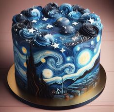 a cake decorated with blue and white icing has the starr night theme on it