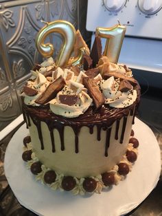 a birthday cake with chocolate and marshmallows is decorated with the number twenty five