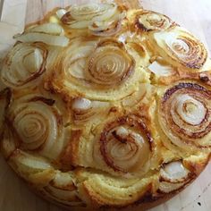 an onion dish is shown on a cutting board