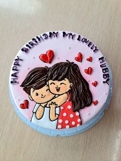 a birthday cake decorated with an image of two people hugging