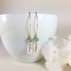 "Pearl Earrings, Gold Pearl Earrings, Pearl Dangle Earrings, Pearl Drop Earrings, Aquamarine Earrings, Aqua Pearl Earrings, Wedding Bridal Earrings, Bridesmaid Gift, Pearl Jewelry Stunning combination, these earrings are composed of a gold plated faceted aqua glass connector with a 14x8mm faux teardrop pearl dangling beneath and simply hung from long gold tone copper ear wires. Can be made in a short version if desired. Dangle length is 2-1/4\" (58mm) from the top of ear wire. Discount for multi French Hook Pearl Drop Earrings For Wedding, Drop Pearl Earrings With French Hook For Wedding, French Hook Dangle Jewelry For Wedding, Dangle Hoop Earrings With Ear Wire For Wedding, Wedding Pearl Drop Earrings With French Hook, French Hook Dangle Wedding Jewelry, Dangle Earrings For Bridesmaid Gift, Wedding Dangle Jewelry With French Hook, Earrings Gold Pearl