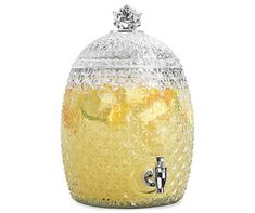 a glass jar filled with lemonade and ice