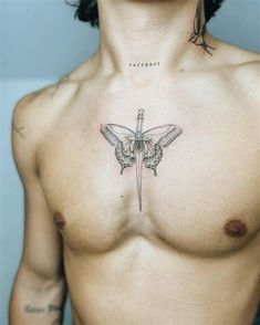 a man with a tattoo on his chest