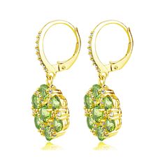 These luxurious earrings feature a cluster of peridot and white topaz gemstones forming a flower design. The earrings are crafted of yellow gold flashed sterling silver and secured by lever-backs. Product Details Metal Type yellow-gold-flashed-silver Metal Stamp 925-sterling Weight 5.4GR Length 31MM Width 14MM Back Finding lever-back Stone Details Gem Type peridot Number of Stones 14 Stone Shape round-shape Total Weight 3.7 Setting Type prongs Stone Creation Method natural Stone Treatment Method Luxurious Earrings, Luxury Earrings, Leverback Earrings, Topaz Gemstone, White Topaz, Metal Stamping, A Flower, Flower Design, Round Shape