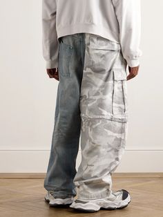 Demna looked to '00s celebrity street style as inspiration for Balenciaga's AW24 collection. A hybrid between jeans and cargos, these trousers are made from panels of camouflage-print cotton-ripstop and distressed selvage denim. They're cut for a baggy, wide-leg fit and have a drawstring waistband that references skate culture. Large to size. See Size & Fit notes. Acid Wash Cotton Streetwear Pants, Distressed Rigid Denim Bottoms For Streetwear, Streetwear Washed Rigid Denim Cargo Jeans, Balenciaga Denim Pants, Streetwear Faded Rigid Denim Cargo Jeans, Ripstop Pants, Selvage Denim, Camouflage Pants, Wardrobe Edit