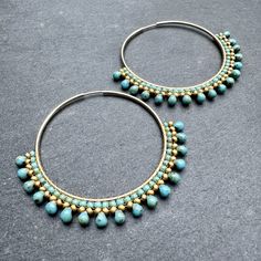 Turquoise Earrings With Gold Beads, Turquoise Hoop Earrings With Tiny Beads, Turquoise Hoop Jewelry With Tiny Beads, Bohemian Tiny Beads Hoop Jewelry, Bohemian Hoop Jewelry With Tiny Beads, Turquoise Hoop Earrings With Dangling Beads, Turquoise Hoop Beaded Earrings For Jewelry Making, Artisan Turquoise Hoop Earrings, Handmade Turquoise Hoop Earrings With Round Beads