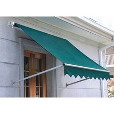 a green awning on the side of a building