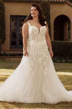 a woman standing in front of a house wearing a wedding dress