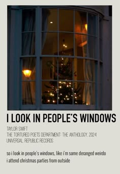 a window with the words i look in people's windows on it and a christmas tree outside