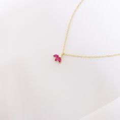 Your Ruby Flower Pendant is stylish, dainty and pretty ideal for everyday use. Details of solid gold handmade Triple Ruby Jewelry are very eye-catching. It is a great gift for your loved ones. This jewelry will be an indispensable piece of yours. This meaningful July Birthstone Necklace with high quality handwork will be a legacy you can leave to your family its.  * Ruby Lotus Necklace Details * Material / Gold Kt : This elegant necklace is made of 14k and 18k Solid Gold * Available Gold Colors Red Minimalist Birthstone Necklace, Minimalist Red Gemstone Birthstone Necklace, Dainty Red Birthstone Necklace, Red Delicate Chain Necklace, Dainty Red Birthstone Necklace For Gift, Delicate Red Necklace With Delicate Chain, Minimalist Red Birthstone Necklace, Red Dainty Birthstone Necklace, Pink Ruby Necklace For Gift