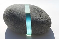 a rock with a thin band on it