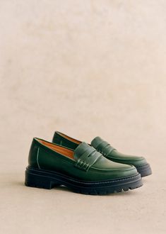 Minimalist loafers;Item made in our Portuguese atelier;Smooth leather exterior;Leather lining and insole;Rubber outsole;Heel height: 3 cm / 1.2 in;Platform height: 2 cm / 0.8 in Green Fashion Aesthetic, Shoe Rotation, Green Loafers, Lifestyle Dresses, Womens Loafers, Denim Suit, Swimwear Dress, Classic Bags, Sheep Leather