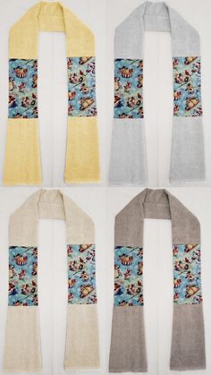 four scarfs with different designs on them, one is yellow and the other two are gray