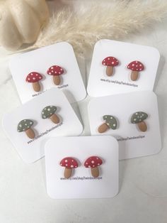 four mushroom shaped magnets on top of each other