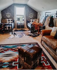 a living room filled with furniture and lots of pillows on top of it's carpet