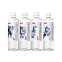 three bottles of water with animals on the side and one has a bird in it