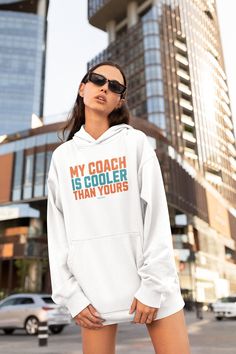 Celebrate Miami Mike, McSwaggy and THE COOLEST COACH in football with this premium sweatshirt hoodie. Layer up year round in this cozy, casual style. With a front pocket and snug hood, it doesn't get much better than this. Great for your favorite Fins fan, birthdays and holiday gifts! Don't you just love sweatshirt weather? We do too. * 100% cotton face * 65% ring-spun cotton, 35% polyester * Front pouch pocket * Matching flat drawstrings * 3-panel hood This product is made especially for you as White Fan Apparel Hoodie For Sports Events, Sports Season Fan Merchandise Hoodie Tops, White Fan Apparel Hoodie For Sports, White Hoodie For Sports In Fan Apparel Style, White Team Spirit Hoodie For Streetwear, White Hoodie For Sports Fan Apparel, White Hooded Sweatshirt For Fan Gear, Casual Sports Season Hoodie For Fans, Sports Fan Hoodie For Streetwear