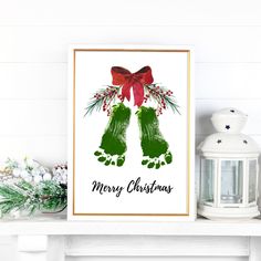 a christmas card with the words merry christmas on it and two green hands holding red bows