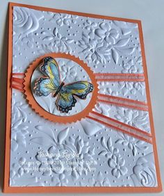 an orange and white card with a butterfly on it