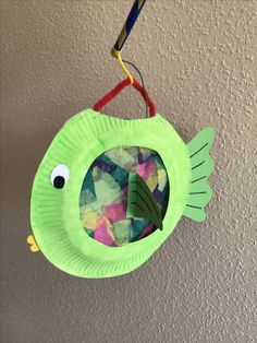 a paper plate fish hanging from the ceiling