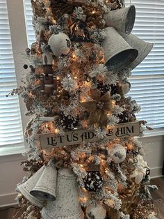 a christmas tree decorated with bells and snowflakes