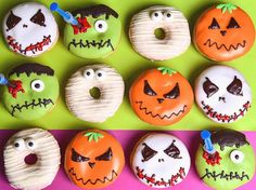 there are many decorated doughnuts with faces on them, and one is for halloween