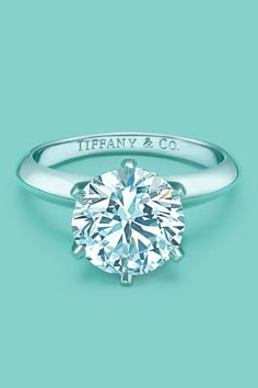 a diamond ring with the words love tiffany blue on it and an image of a round brilliant