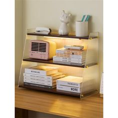 three shelves with books and an air conditioner on top