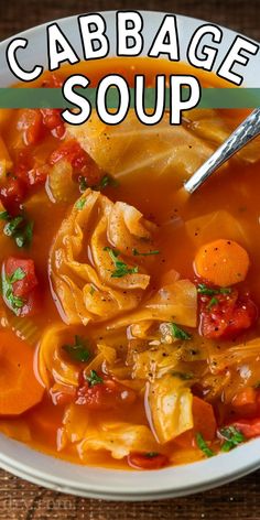 a white bowl filled with cabbage soup on top of a wooden table