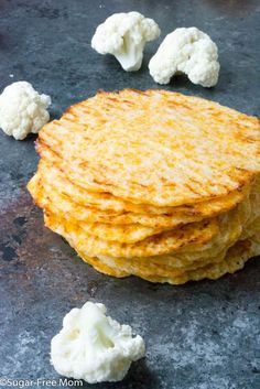 there are some crackers and cauliflower on the table