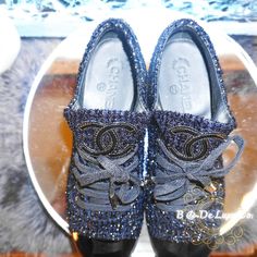 Authentic Chanel Dark Navy Blue. Shiny Ruffles, And Silver Hardware Athletic Shoes. Brand New, Never Worn! Original Box And Dust Bag Included. Price Non-Negotiable. Elegant Silver Sneakers With Rhinestones, Elegant Party Sneakers With Bling, Luxury Party Sneakers, Dark Navy Blue, Chanel Shoes, Blue And Silver, Navy Blue, Athletic Shoes, Dust Bag