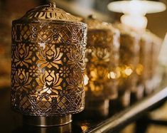 an intricately decorated lantern is sitting on a shelf