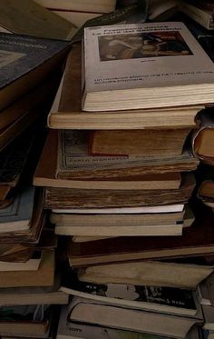 a pile of books sitting on top of a table