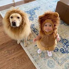 a baby and a dog dressed up as lions