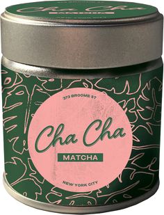 a green tin with a pink circle on it and the words cha cha matcha