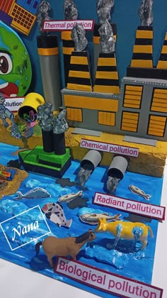 a paper model of an industrial pollution scene with animals and other things on the table