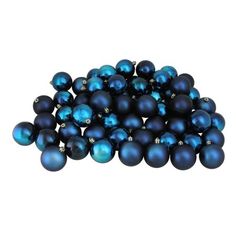 a pile of blue christmas balls sitting on top of each other