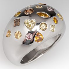 The Hans D. Krieger designed ring is flush set with the seventeen (17) diamonds in various shapes, colors, and sizes described in the appraisal including pink diamonds. The ring measures 14.7mm at the top, rises 6.8mm above the finger, tapering to 5.0mm wide and 1.9mm thick at the base of the shank. The Signed HDK. The ring is crafted in platinum and is currently a size 6.5. Pink Diamonds, Diamond Band Ring, Diamond Rings Bands, Antique Diamond, Fancy Color Diamonds, Diamond Band, Pink Diamond, Diamond Gemstone, Diamond Bands