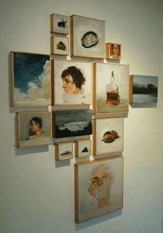 several paintings are hanging on the wall