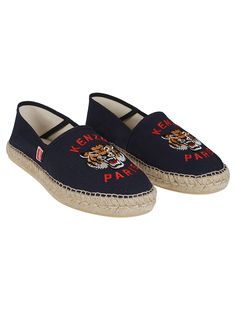 a pair of blue tiger espadros with red lettering on the side and an embroidered tiger