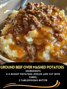 a bowl filled with mashed potatoes covered in gravy and topped with ground beef