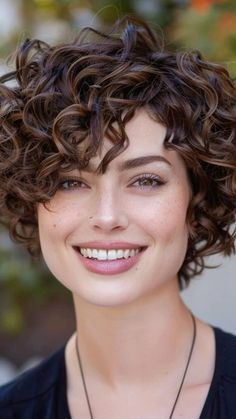 Looking for a fresh look? Explore our collection of stunning short curly haircuts that highlight texture and volume. Perfect for every face shape, these styles are low-maintenance yet trendy, making them ideal for busy lifestyles. From bouncy curls to edgy pixie cuts, find inspiration that suits your personality.    #ShortCurlyHair #CurlyHair #HairInspiration #CurlyHairstyles #TexturedHair #PixieCut #HairGoals #NewLook #HairTrends Shaggy Curly Pixie Haircut, Curly Pixie Oval Face, "bixie" Haircut For Curly Hair, Short Pixie Cuts For Older Women, Curly Short Shag, Very Short Curly Hair Pixie, Short Curly Hair Round Face, Short Curly Wolf Cut, Short Curly Bobs