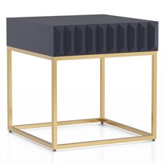 a black and gold side table with geometric shapes on the top, in front of a white background